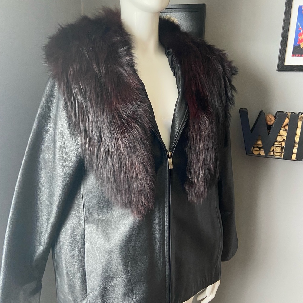 Gorgeous black leather jacket with fur trim collar. The fur is real.